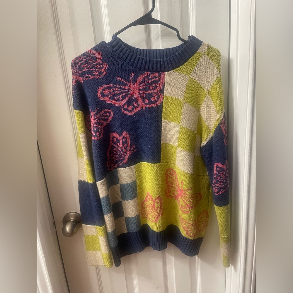 oversized butterfly and checkered sweater
